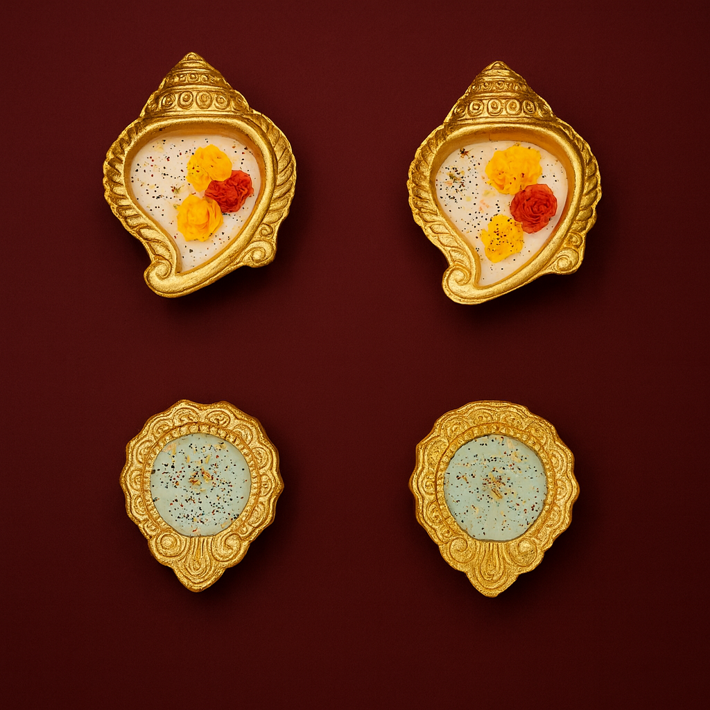 Golden Shankh Aura Set by Karigar Kutir — set of four handcrafted soy wax fragrant candles in ornate golden shankh and diya-shaped holders, decorated with red and yellow floral accents on a deep maroon background for Diwali décor and gifting.