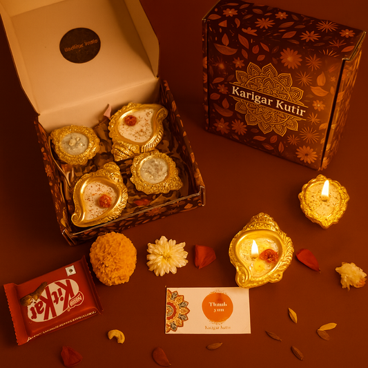 Golden Shankh Aura Gift Set by Karigar Kutir — handcrafted soy wax fragrant candles in ornate golden shankh and diya holders, beautifully packed with flowers, chocolates, and a thank-you card for Diwali gifting and festive décor.