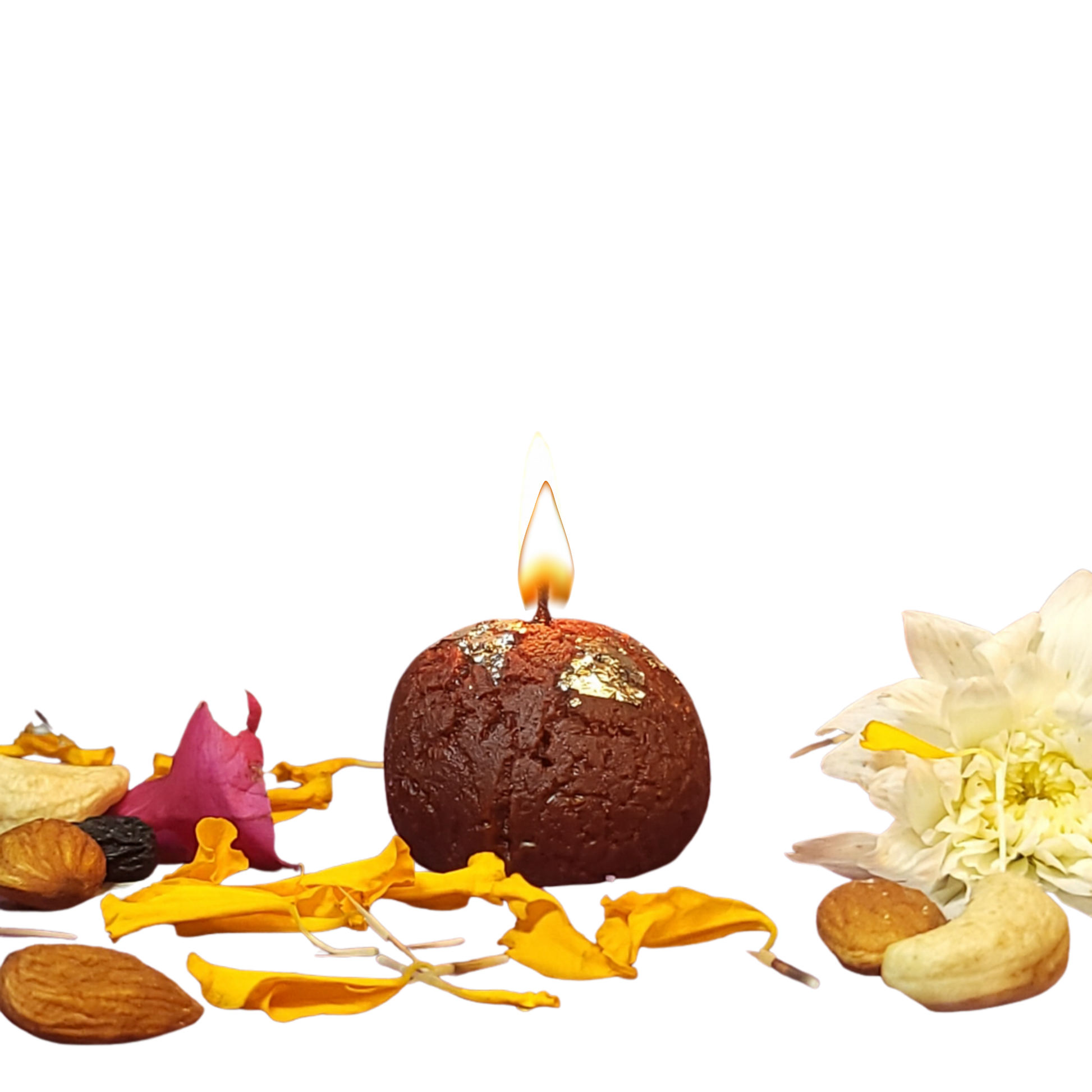Handcrafted Gulab Jamun-shaped soy wax candle with silver varq highlights, surrounded by marigold petals, nuts, and a white flower — festive handmade décor piece from Karigar Kutir symbolizing Indian tradition and warmth.
